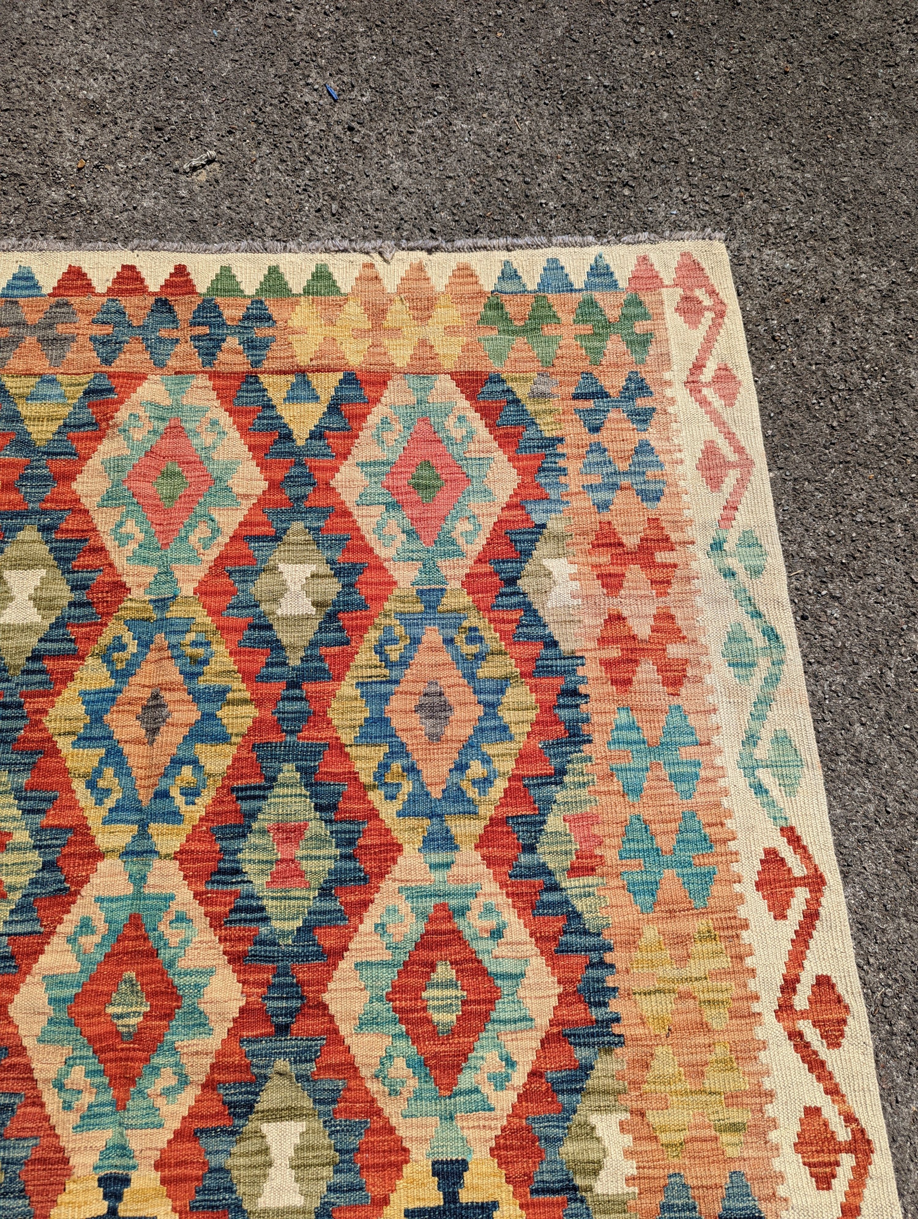 An Anatolian design polychrome geometric flatweave carpet, 196 x 156cm